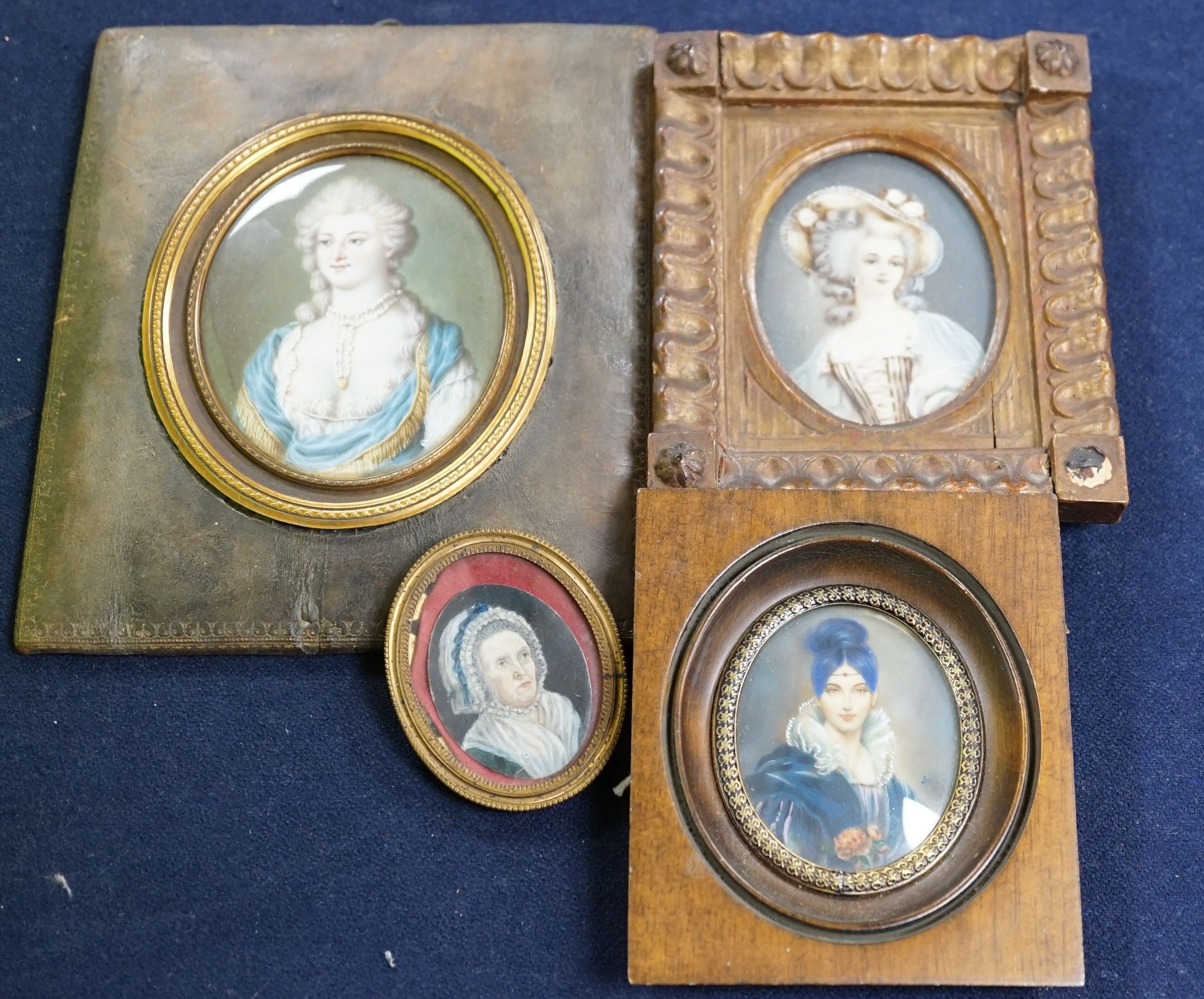 A group of four framed portrait miniatures, tallest 9cm